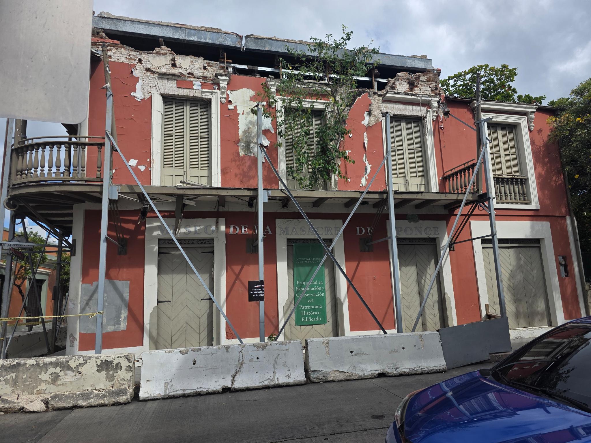 Crumbling museum exterior with scaffolding